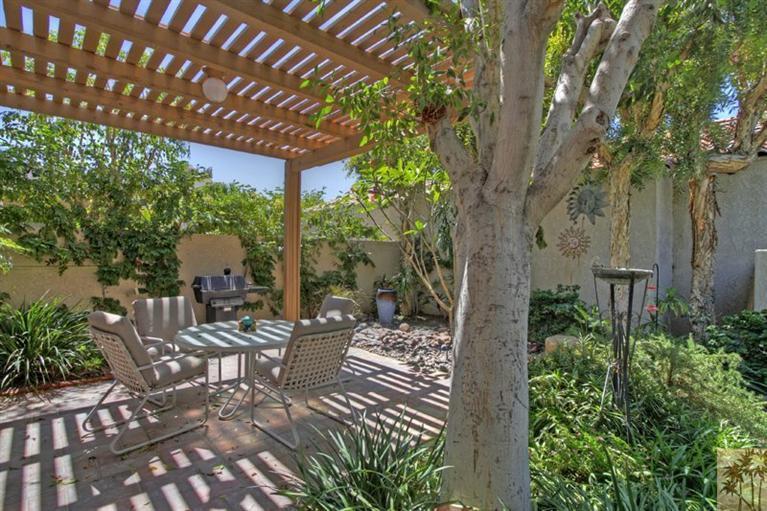 925 Inverness Drive Rancho Mirage, CA 92270 - Photo 31 of 35 a view of a patio with furniture and garden