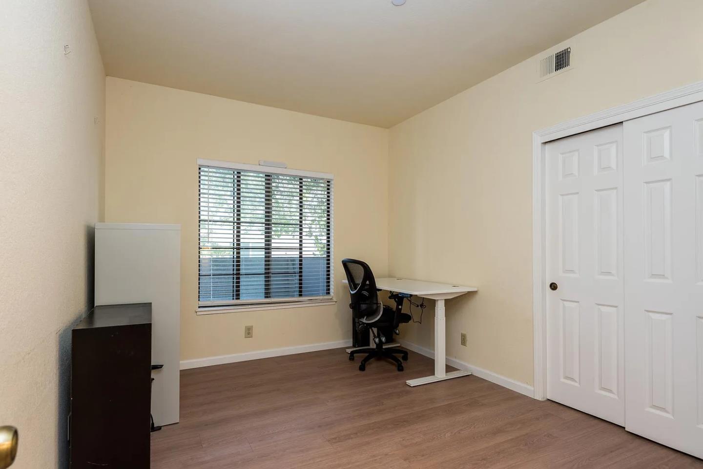 112 Madison Avenue, Unit 108 San Mateo, CA 94402 - Photo 11 of 17 a view of a workspace with furniture and a window