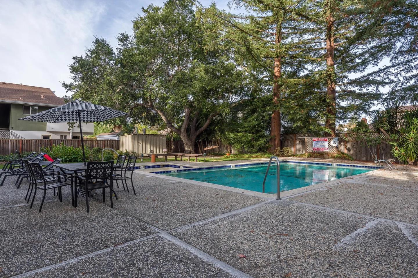 112 Madison Avenue, Unit 108 San Mateo, CA 94402 - Photo 17 of 17 a view of a swimming pool with sitting area