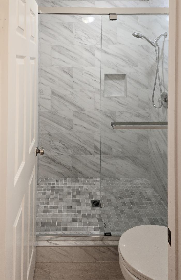 112 Madison Avenue, Unit 108 San Mateo, CA 94402 - Photo 10 of 17 a bathroom with a toilet and a shower