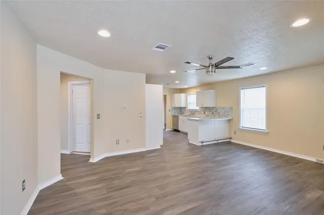 a view of a kitchen with a sink and a window