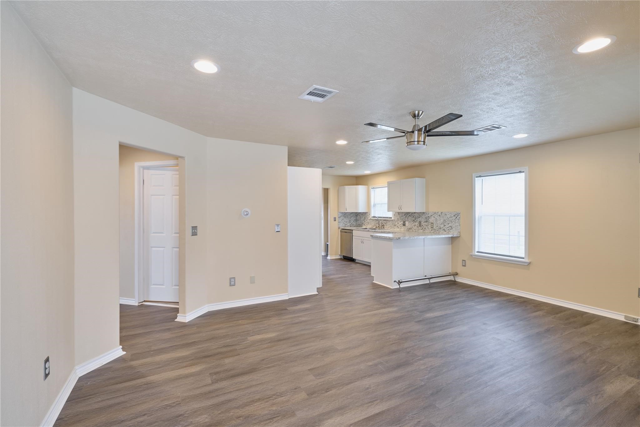 450 Ritchey Road Coldspring, TX 77331 - Photo 13 of 27 a view of a kitchen with a sink and a window