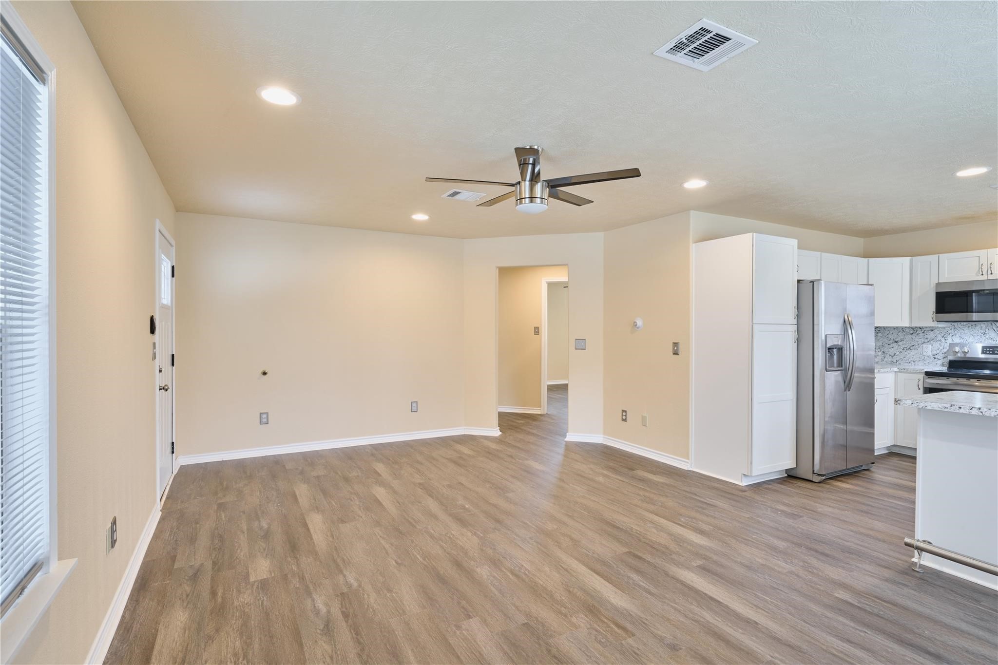 450 Ritchey Road Coldspring, TX 77331 - Photo 15 of 27 a view of a kitchen with a sink and stainless steel appliances