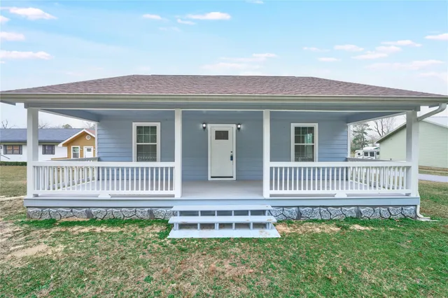 a front view of a house with a porch