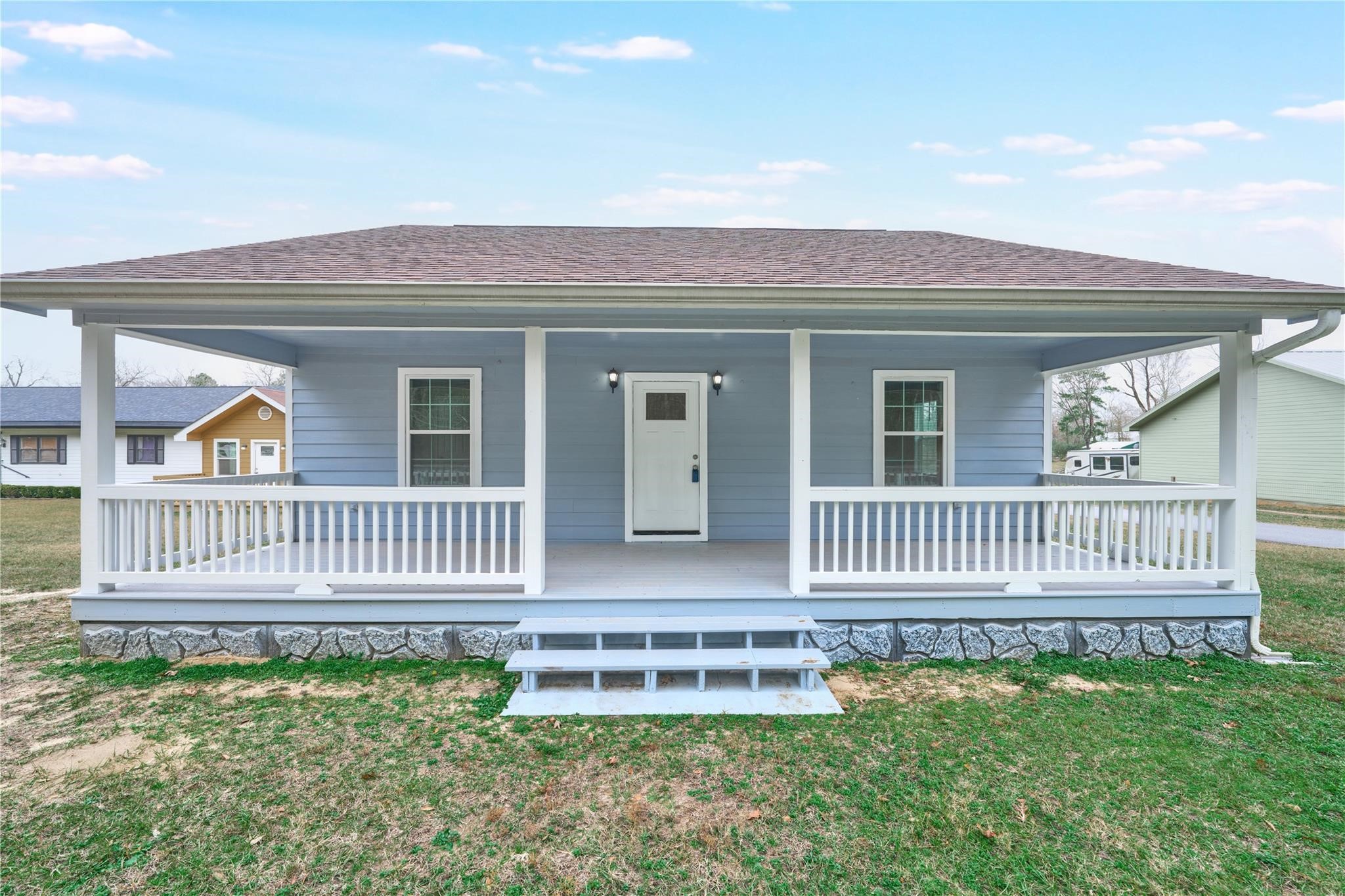 450 Ritchey Road Coldspring, TX 77331 - Photo 2 of 27 a front view of a house with a porch
