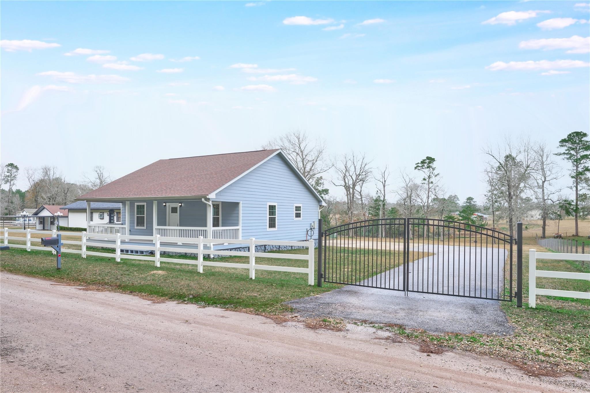 450 Ritchey Road Coldspring, TX 77331 - Photo 3 of 27 front view of a house with a yard