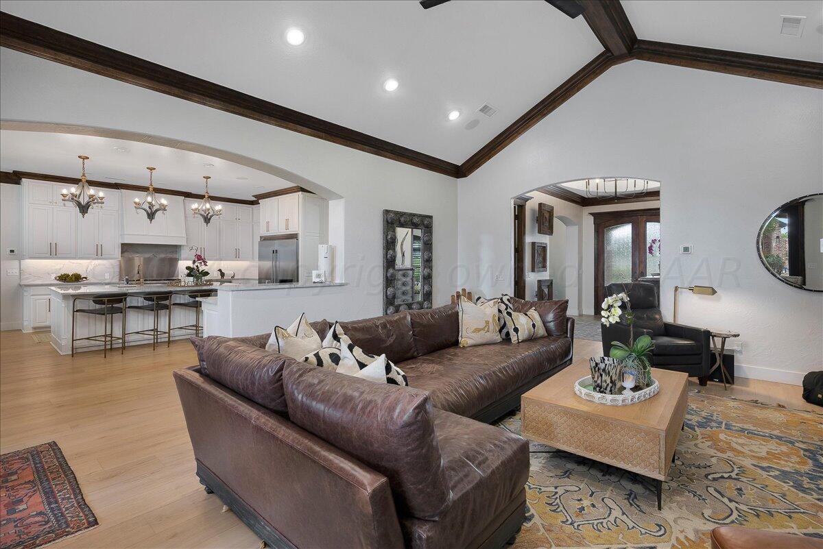 17701 White Wing Road Canyon, TX 79015 - Photo 11 of 76 a living room with furniture and view of kitchen