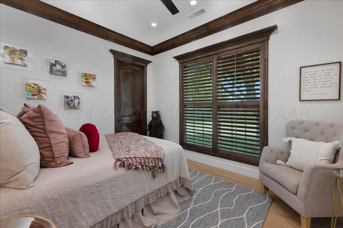 17701 White Wing Road Canyon, TX 79015 - Photo 27 of 76 a bedroom with a large bed and a window