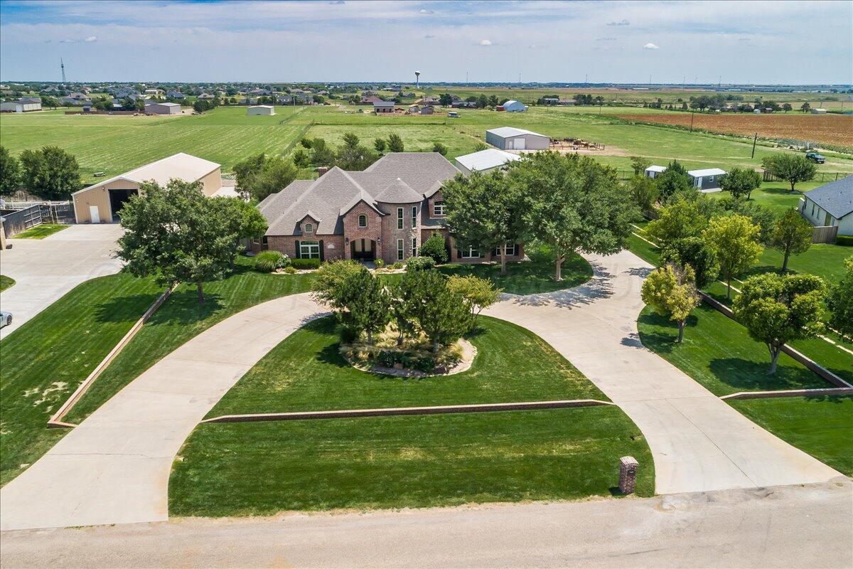 17701 White Wing Road Canyon, TX 79015 - Photo 3 of 76 a view of a lake with a garden and a yard