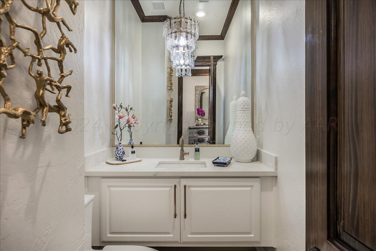 17701 White Wing Road Canyon, TX 79015 - Photo 38 of 76 a bathroom with a sink and a mirror