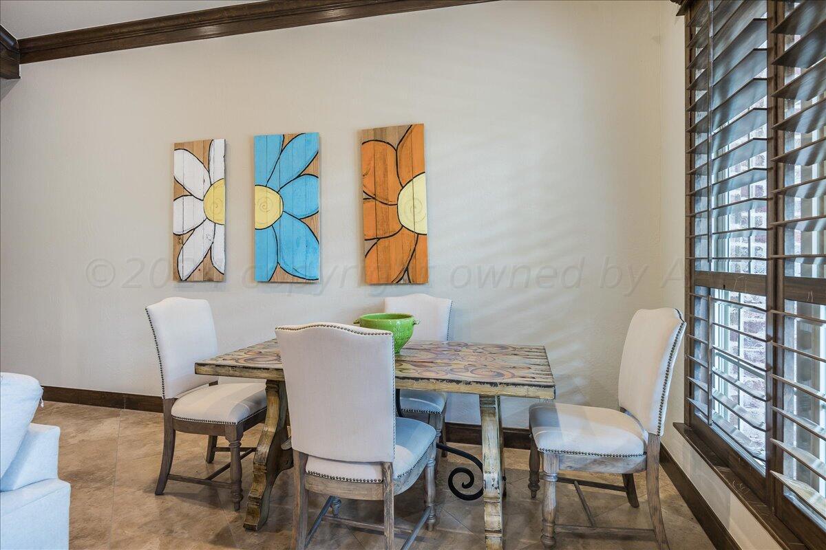 17701 White Wing Road Canyon, TX 79015 - Photo 45 of 76 a view of a dining room with furniture and wooden floor