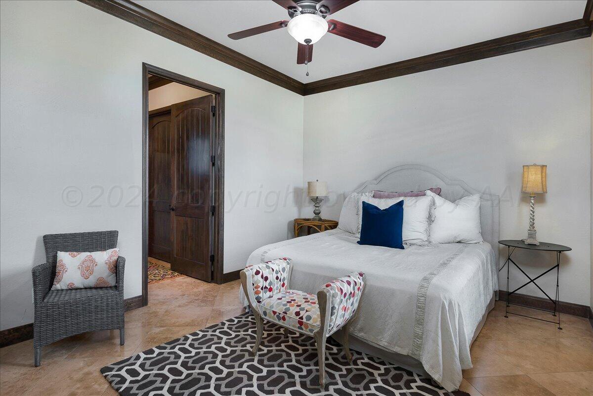 17701 White Wing Road Canyon, TX 79015 - Photo 46 of 76 a bedroom with a bed and a couch