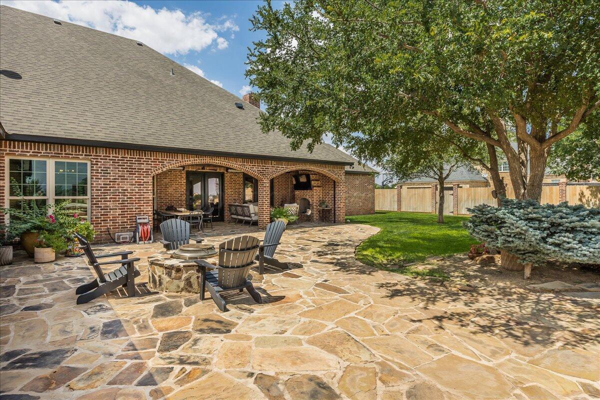 17701 White Wing Road Canyon, TX 79015 - Photo 53 of 76 a patio with a table and chairs and potted plants