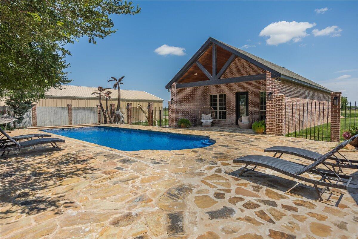 17701 White Wing Road Canyon, TX 79015 - Photo 57 of 76 a front view of house with yard outdoor seating and barbeque oven