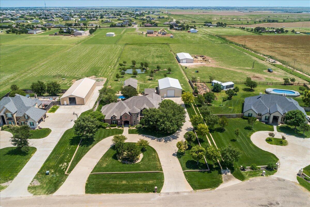 17701 White Wing Road Canyon, TX 79015 - Photo 67 of 76 an aerial view of a house with a lake view