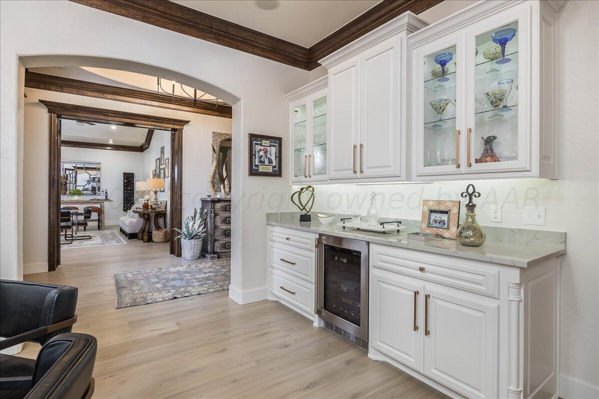 17701 White Wing Road Canyon, TX 79015 - Photo 7 of 76 a spacious bathroom with a granite countertop sink and a mirror