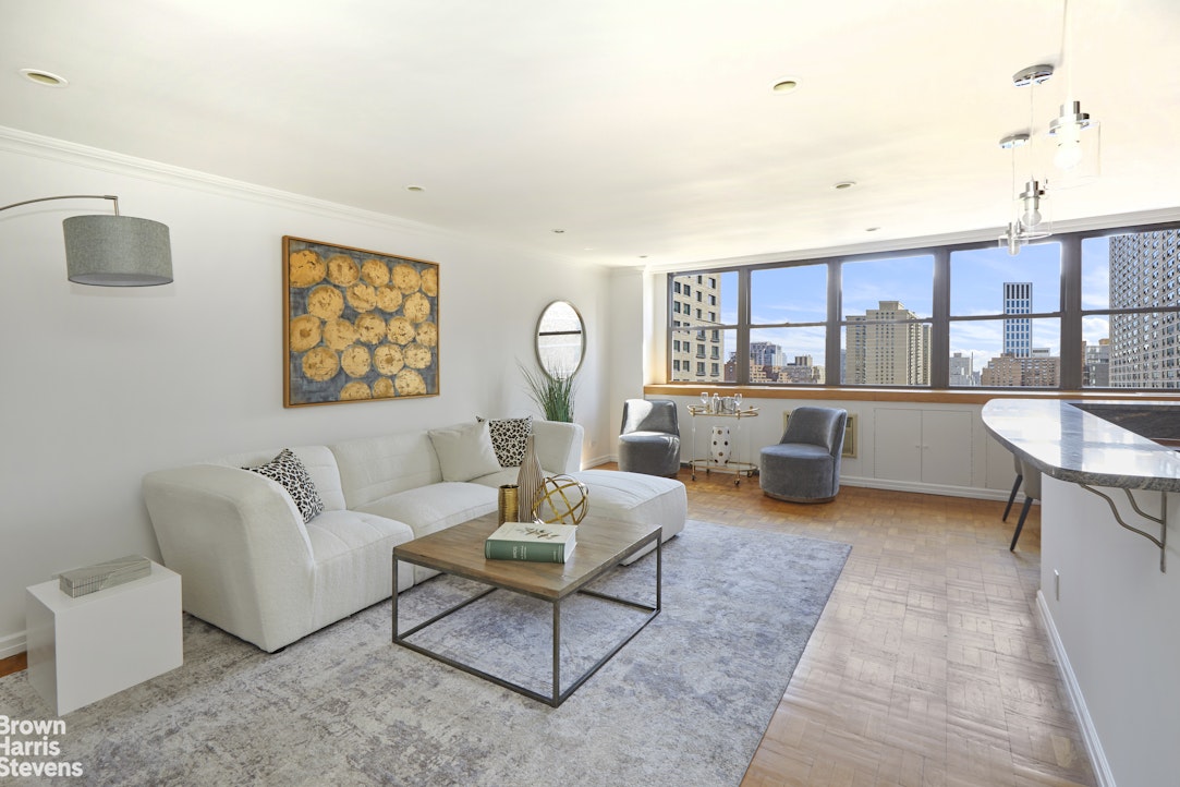 a living room with furniture and a table