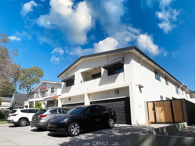 a view of a car park in front of house