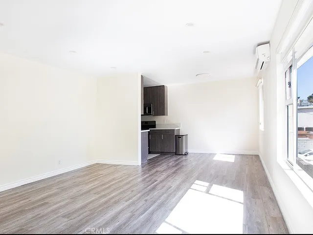 a view of a kitchen with a sink and dishwasher