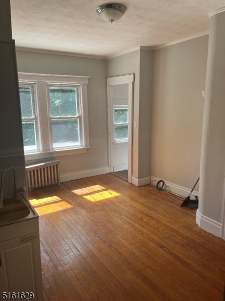 209 Hillside Avenue, Unit 2 Glen Ridge, NJ 07028 - Photo 13 of 17 an empty room with a window
