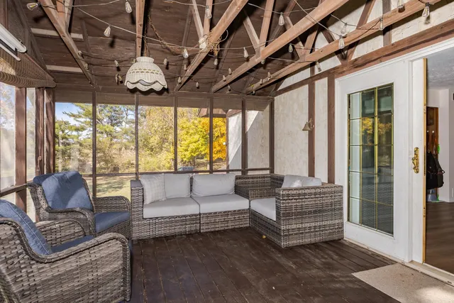 a kitchen with a sink window and cabinets