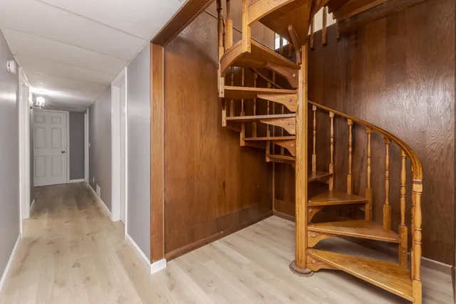 a bedroom with a bed lamp and window