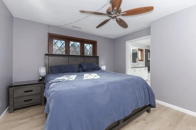 a bedroom with a bed and a couch