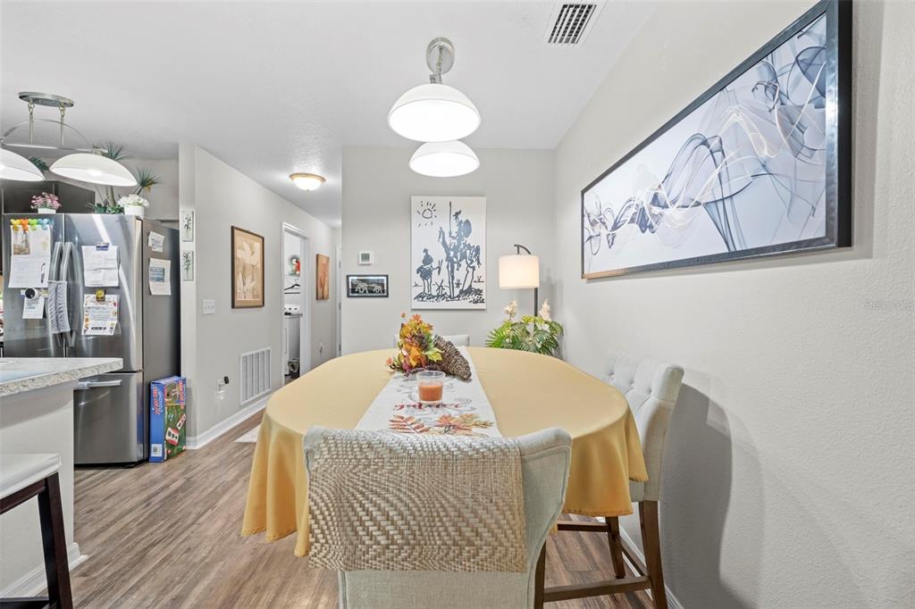 26448 Bertram Road Brooksville, FL 34602 - Photo 12 of 31 a living room with furniture and wooden floor