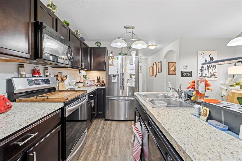 26448 Bertram Road Brooksville, FL 34602 - Photo 15 of 31 a kitchen with granite countertop lots of counter top space appliances and furniture