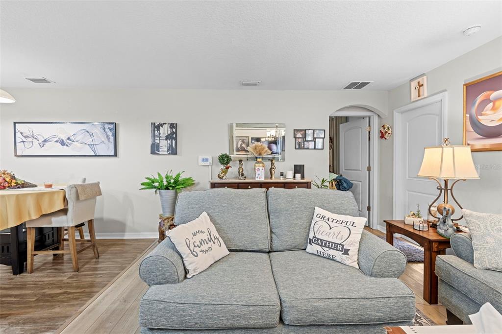 26448 Bertram Road Brooksville, FL 34602 - Photo 19 of 31 a living room with furniture and a table