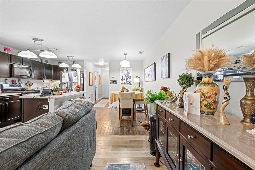 26448 Bertram Road Brooksville, FL 34602 - Photo 22 of 31 a living room with furniture kitchen view and a large window