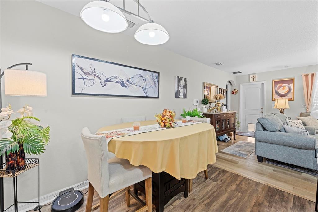 26448 Bertram Road Brooksville, FL 34602 - Photo 9 of 31 a living room with furniture and a potted plant