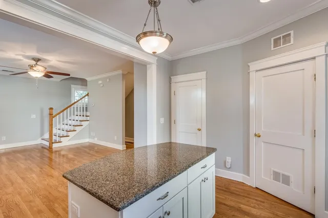 a view of a kitchen cabinets and wooden floor
