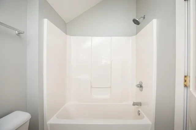 a bathroom with a white bath tub