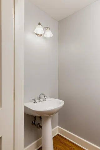 a bathroom with a sink a mirror and a toilet