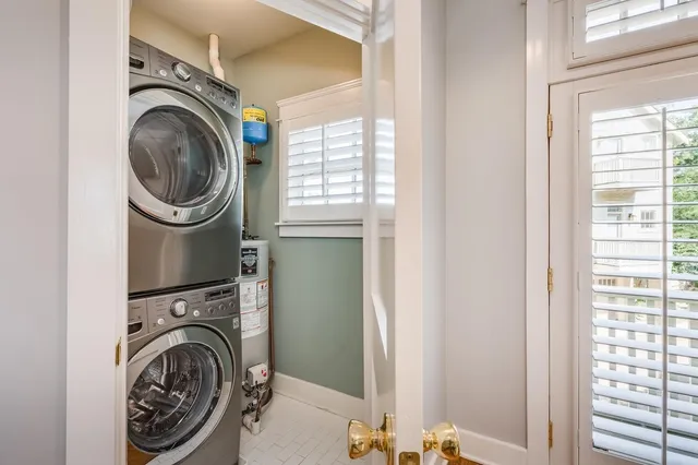 a view of a bedroom with washer and dryer