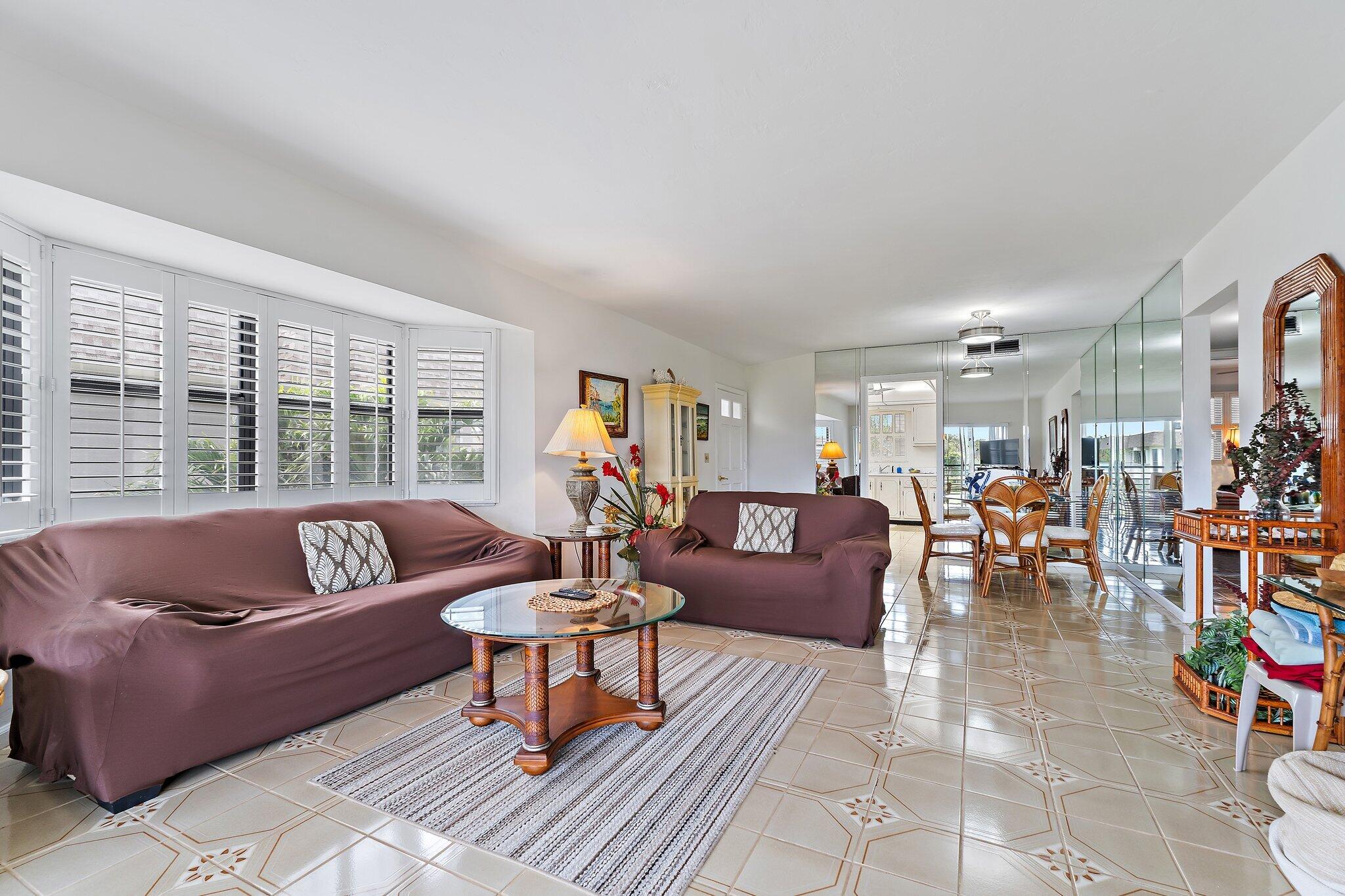 755 Saturn Street, Unit D 201 Jupiter, FL 33477 - Photo 25 of 42 a living room with furniture and a large window