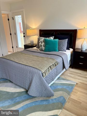 a bedroom with a bed and a night stand