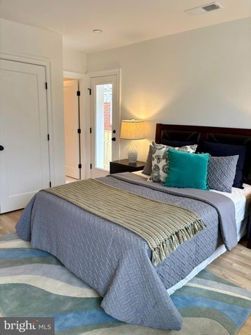 a bedroom with a bed and a night stand