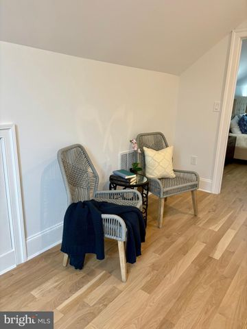 a bathroom with double sink and a mirror