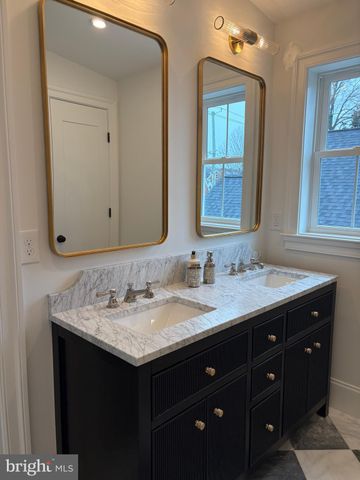 a bathroom with a shower and sink