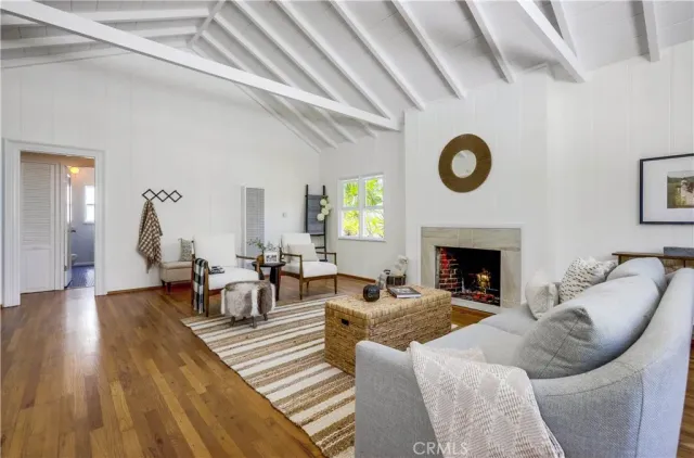 a kitchen with a white table and chairs in it