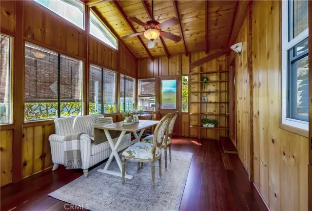 a kitchen with kitchen island granite countertop a stove a sink and a refrigerator