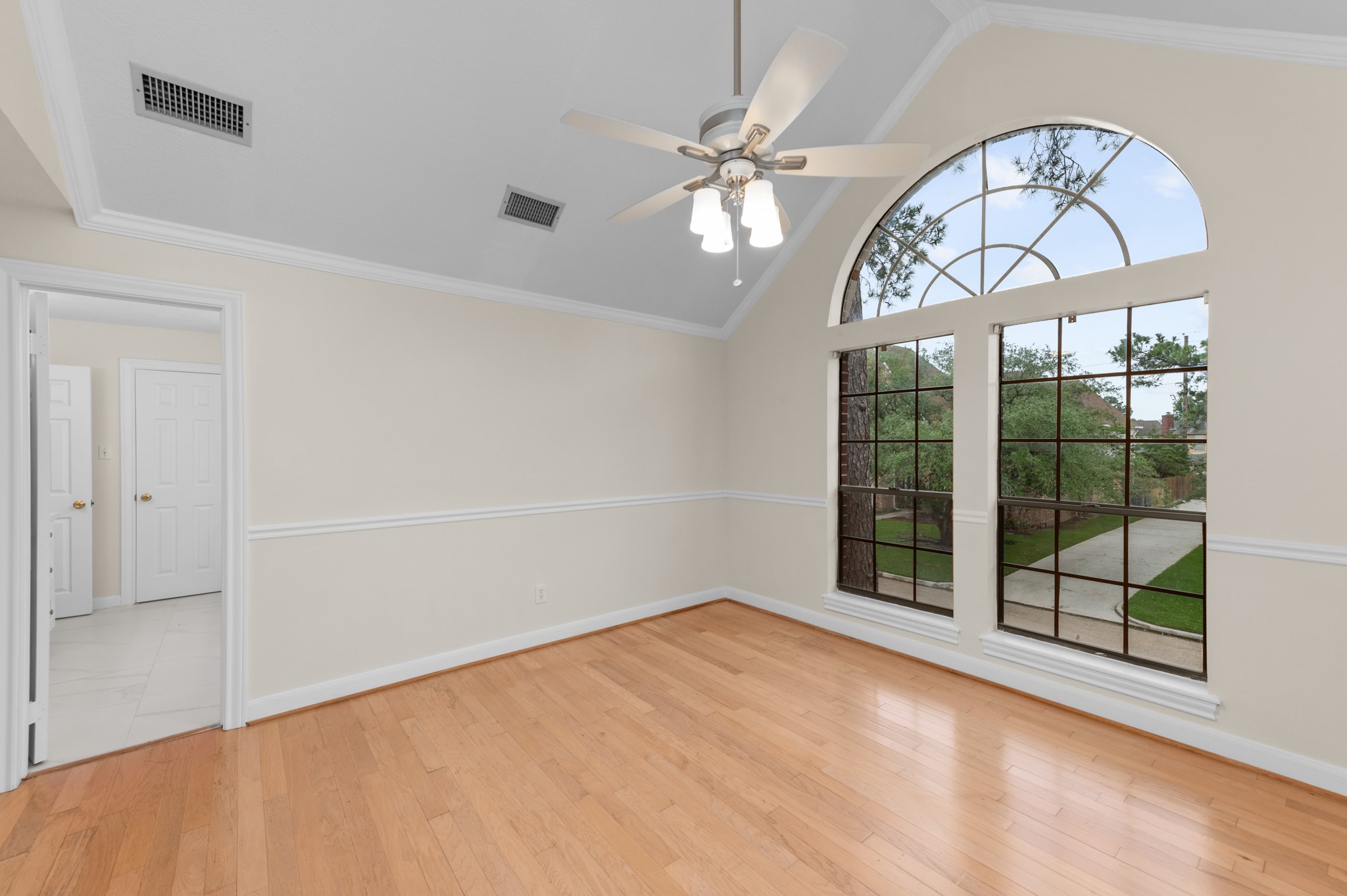 17402 Wilton Park Court Spring, TX 77379 - Photo 45 of 50 an empty room with windows and wooden floor