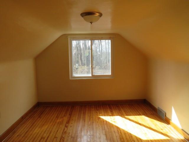 80 Woods Road Pittsburgh, PA 15235 - Photo 11 of 21 an empty room with wooden floor and windows