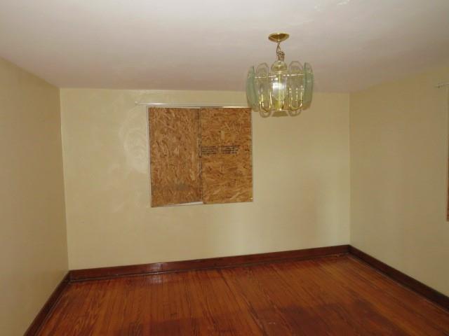 80 Woods Road Pittsburgh, PA 15235 - Photo 2 of 21 an empty room with wooden floor fan and windows