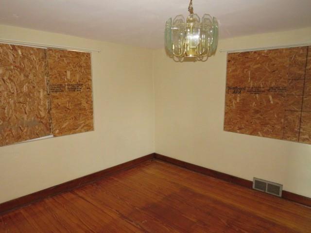 80 Woods Road Pittsburgh, PA 15235 - Photo 3 of 21 a view of a small space with wooden floor and a chandelier