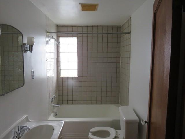 80 Woods Road Pittsburgh, PA 15235 - Photo 4 of 21 a bath tub sitting next to a blue sink and a shower