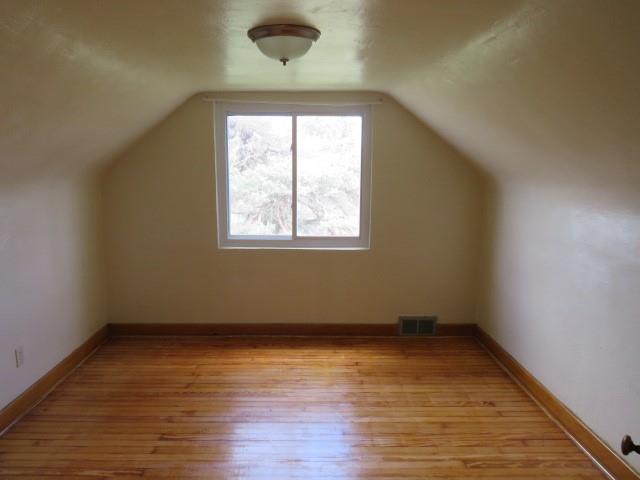 80 Woods Road Pittsburgh, PA 15235 - Photo 9 of 21 an empty room with wooden floor and windows