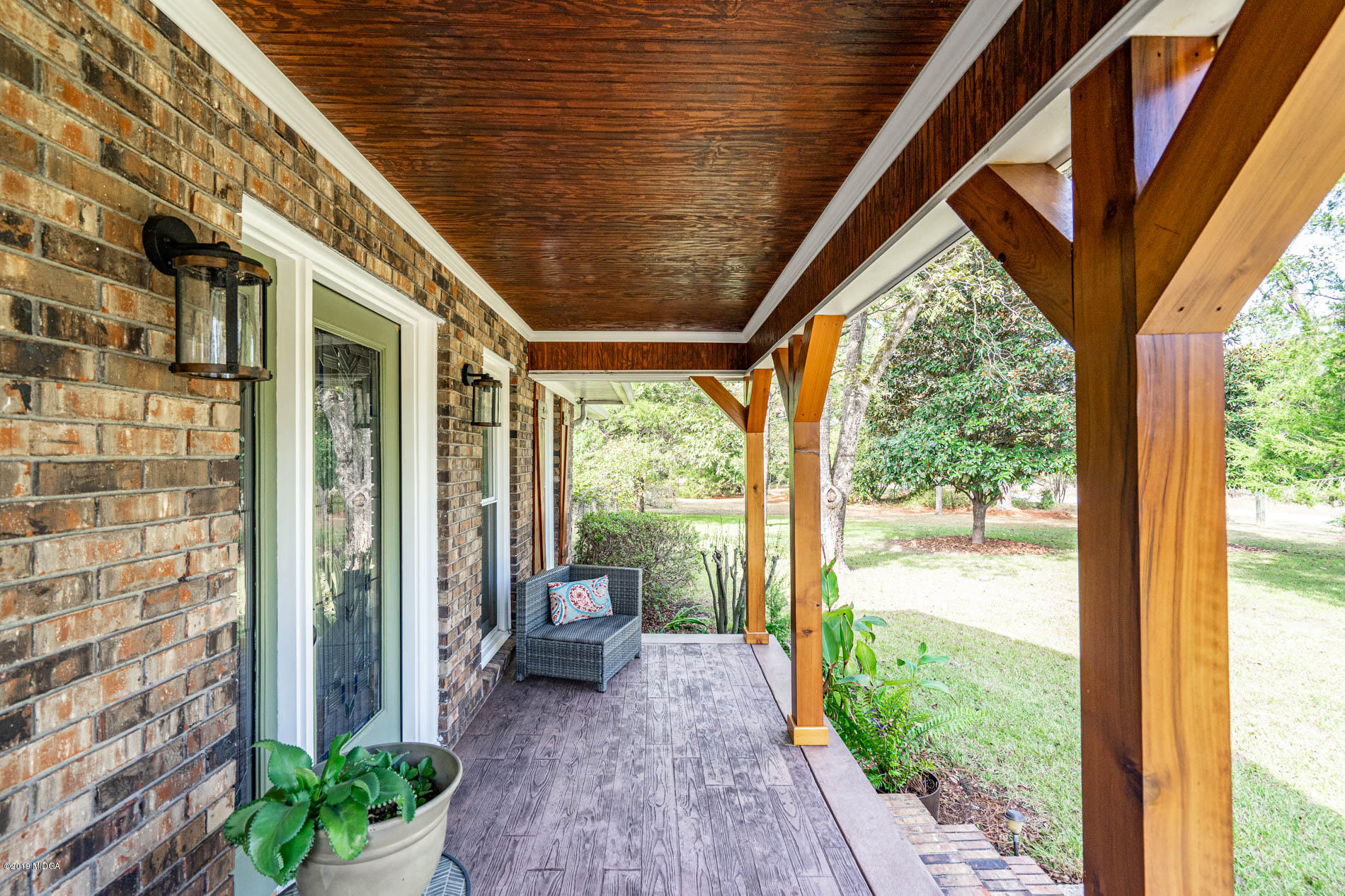 2064 Midway Road Lizella, GA 31052 - Photo 2 of 40 a view of a porch with chairs and backyard